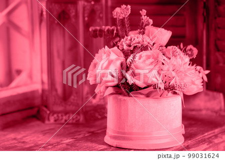 flower composition on the window with a decorative candlestick, toned in pink flower composition on the window with a decorative candlestick, toned in pink 99031624