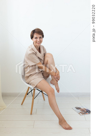 Woman wears pajama. Close-up detail and fabric texture of a pajama. Homewear, sleepwear, shopping and sale 99032220