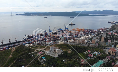 Top view. Vladivostok Commercial Sea Port. Industrial port with containers in Vladivostok. Top view. Vladivostok Commercial Sea Port. Industrial port with containers in Vladivostok. 99032331