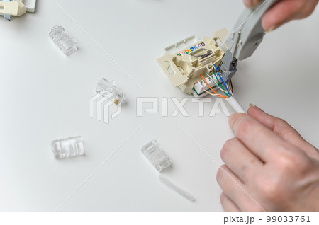 installing a wall ethernet socket. Connecting wires to an socket. 99033761