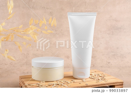White squeeze bottle plastic tube mockup for cosmetics and jar with facial moisturizer cream on beige background 99033897
