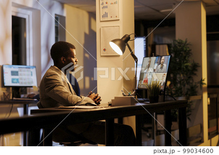 Businessman talking with remote employees during videocall meeting conference, discussing company growth report working at financial strategy in startup office. Management business concept Businessman talking with remote employees during videocall meeting conference, discussing company growth report working at financial strategy in startup office. Management business concept 99034600