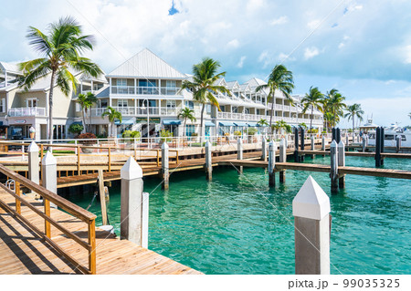 Quiet Street In Key West, Florida with wooden pier 99035325