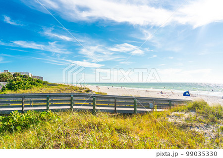 Wooden Boardwalk to Indian rocks beach in Florida, USA 99035330