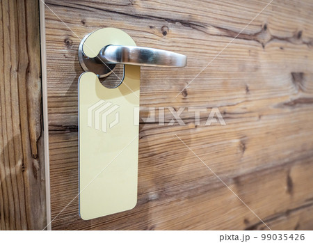 An empty sign on the hotel door handle for your text An empty sign on the hotel door handle for your text 99035426