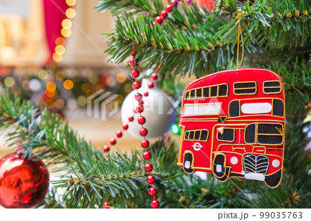 Christmas tree decoration with a red double-decker London bus 99035763
