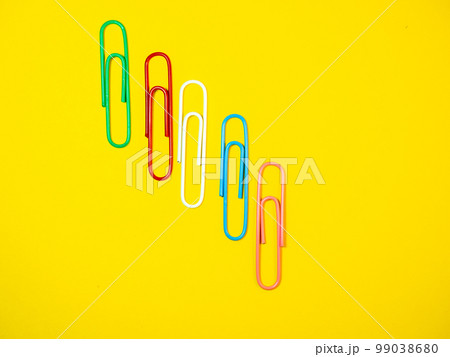 Large multi-colored paper clips. Paperclip of documents. Bright stationery Large multi-colored paper clips. Paperclip of documents. Bright stationery 99038680