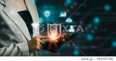 Technology and business. Businesswoman using smartphone to connecting and privacy locked blurred blue and dark background.. Technology and business. Businesswoman using smartphone to connecting and privacy locked blurred blue and dark background.. 99040786
