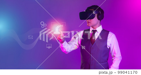 Businessman wearing vr headset, finger touching on icon, control virtual reality world. Business and technology concept. Businessman wearing vr headset, finger touching on icon, control virtual reality world. Business and technology concept. 99041170
