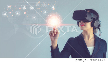 Young businesswoman wearing vr headset watching and managing big data by finger touching on virtual digital icon. Metaverse and Technology concept.. Young businesswoman wearing vr headset watching and managing big data by finger touching on virtual digital icon. Metaverse and Technology concept.. 99041173