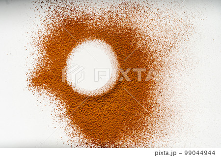 A trace of cocoa, which was sprinkled on something on a white background. 99044944