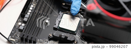 Man assembles components to build computer closeup 99046207