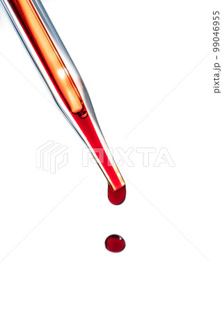 The hand holds a test tube with blood. The hand holds a test tube with blood. 99046955