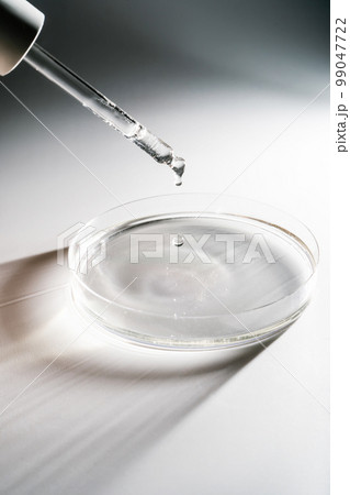 Falling water drops on a shadow background. Falling water drops on a shadow background. 99047722