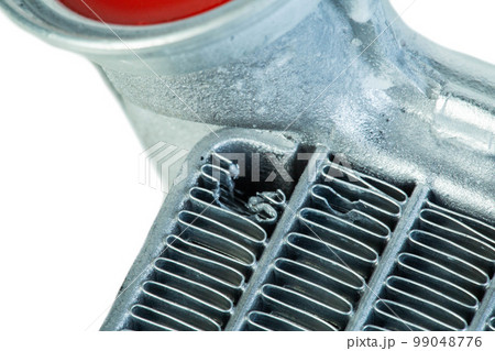 Damaged car heater core. Damaged honeycombs on an aluminum car radiator. Close-up 99048776