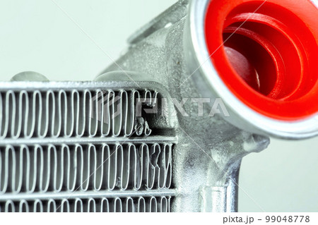 damaged honeycombs on a car radiator, close-up. Broken radiator, close-up 99048778