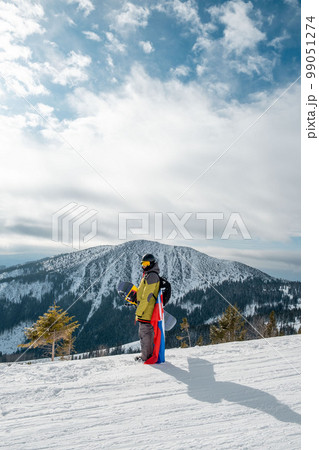 man snowboarder with slovakia flag at ski resort slope man snowboarder with slovakia flag at ski resort slope 99051274