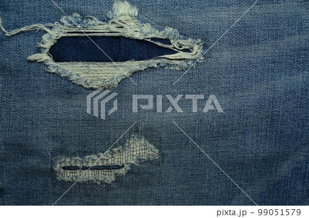 torn on denim jean textile 99051579