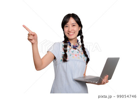 Portrait of beautiful happy young freelance asian woman in denim dress using laptop work with success on white background Portrait of beautiful happy young freelance asian woman in denim dress using laptop work with success on white background 99054746