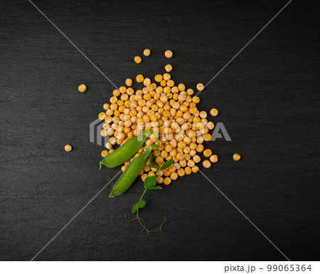 Dry Scattered Yellow Peas on Black Background, Whole Pea Pile, Raw Legume, Protein Source, Healthy Vegan Food Dry Scattered Yellow Peas on Black Background, Whole Pea Pile, Raw Legume, Protein Source, Healthy Vegan Food 99065364
