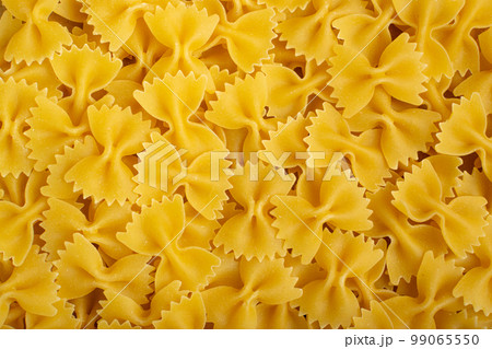 Raw Farfalle Pasta Texture Background, Yellow Dry Butterfly Noodles Pattern, Wheat Bow Macaroni Mockup Raw Farfalle Pasta Texture Background, Yellow Dry Butterfly Noodles Pattern, Wheat Bow Macaroni Mockup 99065550