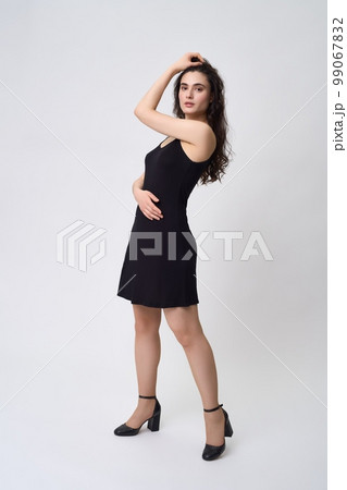 Elegant woman in black dress Elegant woman in black dress 99067832