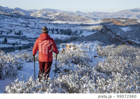 male hiker in winter scenery of Rocky Mountains foothills in northern Colorado, Lory State Park 99072980