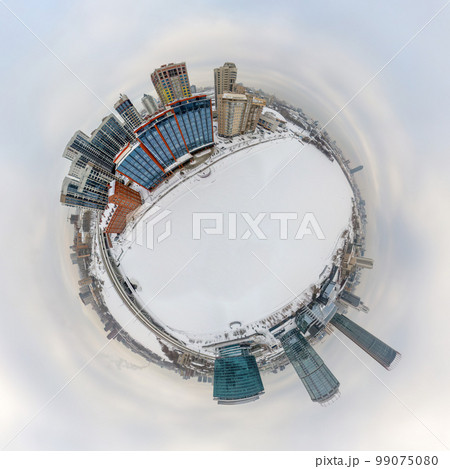 Aerial winter city view with crossroads and roads, houses, buildings, parks and bridges. Copter shot. Little planet sphere mode. 99075080