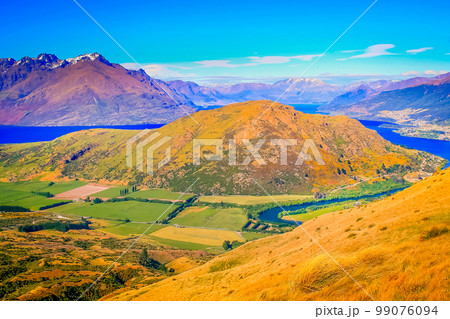 Above Queenstown and Lake Wakatipu in south Island, New Zealand at sunset Above Queenstown and Lake Wakatipu in south Island, New Zealand at sunset 99076094