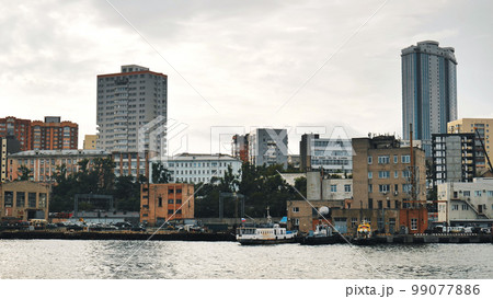 Panorama of the Russian city of Vladivstok. View from the moving ferry. 99077886