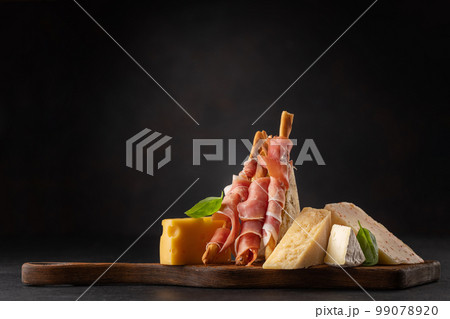 Antipasto board with various cheese and snacks 99078920