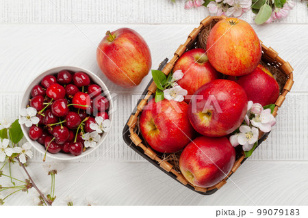 Ripe red apples and cherry Ripe red apples and cherry 99079183