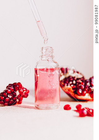 Pomegranate oil in a cosmetic bottle with a pipette. Natural cosmetics and face care 99081987