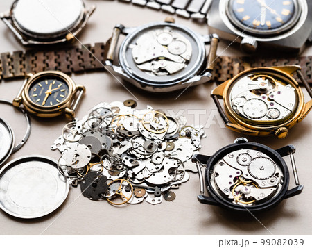pile of old spare parts and mechanical watches pile of old spare parts and mechanical watches 99082039