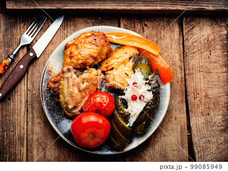 Baked chicken meat and pickles. Baked chicken meat and pickles. 99085949