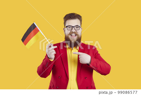 Happy bearded fat man with German flag is very happy about studying German language 99086577