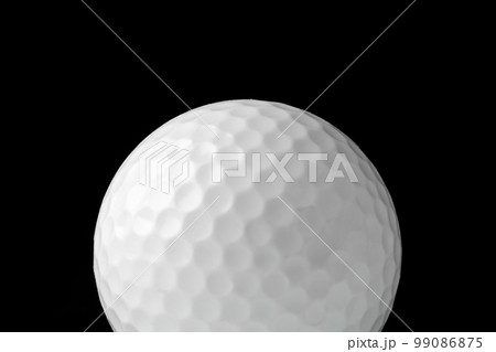 Golf ball close up on black background 99086875