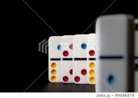 Domino game. Dominoes on a black table Domino game. Dominoes on a black table 99086878