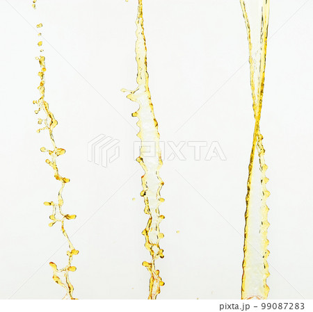 Orange, lemon juice or oil lubricant splash, liquid gold yellow drink drops. Fruit beverage water elements in line form . Fresh splashing and flowing jets, white background isolated freeze motion Orange, lemon juice or oil lubricant splash, liquid gold yellow drink drops. Fruit beverage water elements in line form . Fresh splashing and flowing jets, white background isolated freeze motion 99087283