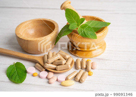 Alternative medicine herbal organic capsule with vitamin E omega 3 fish oil, mineral, drug with herbs leaf natural supplements for healthy good life. Alternative medicine herbal organic capsule with vitamin E omega 3 fish oil, mineral, drug with herbs leaf natural supplements for healthy good life. 99091346