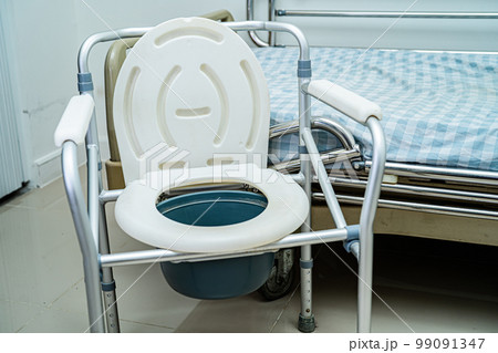 Flush toilet and shower chair in bathroom for old elder people. Flush toilet and shower chair in bathroom for old elder people. 99091347