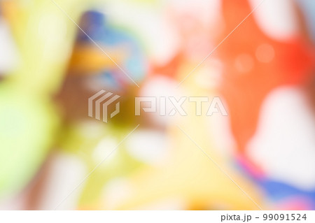 Colorful blurred glitter bokeh background. Yellow, blue, red, green. Copy Space 99091524