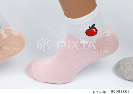 Socks on a white background. Socks on the leg. 99093302