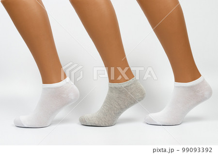 Socks on a white background. Socks on the leg. 99093392