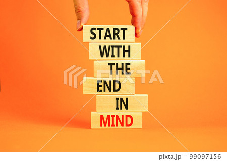 Start in end of mind symbol. Concept words Start with the end in mind on wooden blocks. Beautiful orange table orange background. Businessman hand. Business start in end of mind concept. Copy space. Start in end of mind symbol. Concept words Start with the end in mind on wooden blocks. Beautiful orange table orange background. Businessman hand. Business start in end of mind concept. Copy space. 99097156