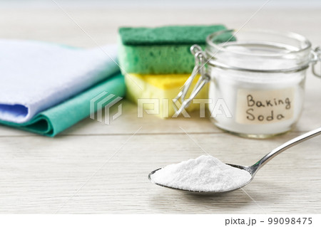house care natural healthy cleaning with baking soda on a white wooden table. house care natural healthy cleaning with baking soda on a white wooden table. 99098475