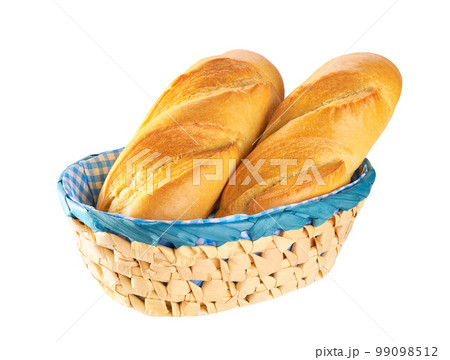 Fresh french bread in basket isolated on white background with clipping path. Fresh french baguette in basket isolated. 99098512