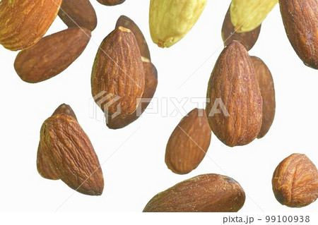 Falling almond isolated on a white background, selective focus. Almond nuts levitate on a white background. Freeze motion of flying whole almonds. Studio shot, white background. Macro image and Falling almond isolated on a white background, selective focus. Almond nuts levitate on a white background. Freeze motion of flying whole almonds. Studio shot, white background. Macro image and 99100938