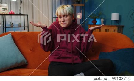 Confused woman feeling embarrassed about ambiguous question, having doubts, no idea Confused woman feeling embarrassed about ambiguous question, having doubts, no idea 99108710