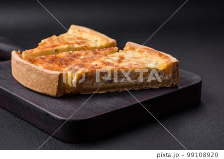 Beautiful delicious quiche pie with four types of cheese with spices and herbs 99108920